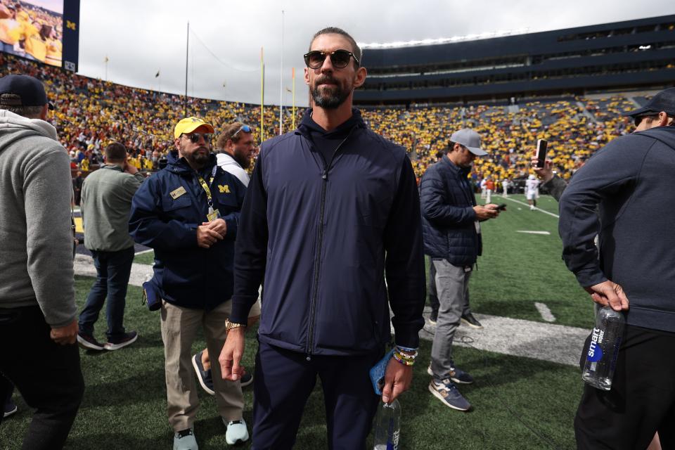 ANN ARBOR, MICHIGAN - SEPTEMBER 07: Michael Phelps is seen on the field prior to a game between the Michigan Wolverines and the Texas Longhorns at Michigan Stadium on September 07, 2024 in Ann Arbor, Michigan. (Photo by Gregory Shamus/Getty Images)