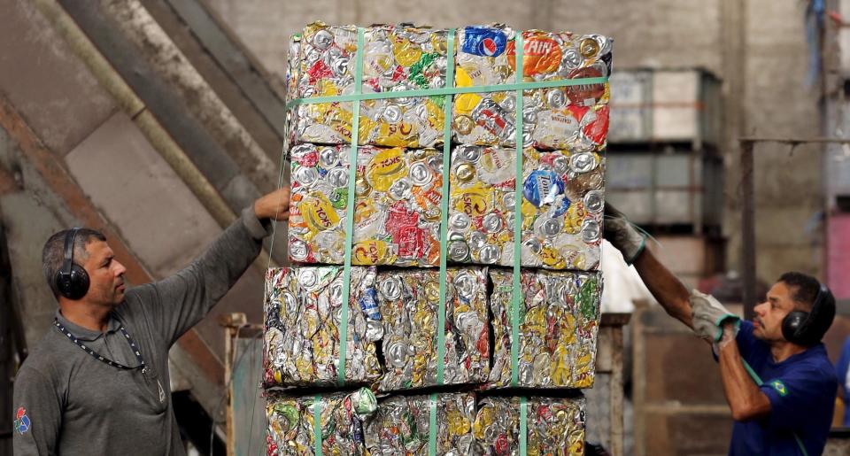 recycling recycled cans blocks warehouse workers teamwork Paulo Whitaker RTS28YI