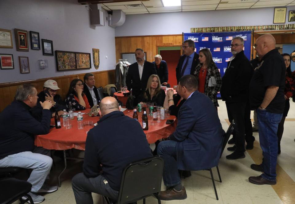 Supporters of Dorey Houle, seated third from left, surround her as they wait for results at the local Republicans and Colin Schmitt's election night party in New Windsor on November 8, 2022. 