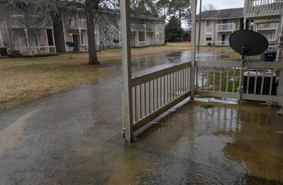 Running water floods the grounds Jan. 24 at Brentwood Estates in Montgomery and gets into apartments.