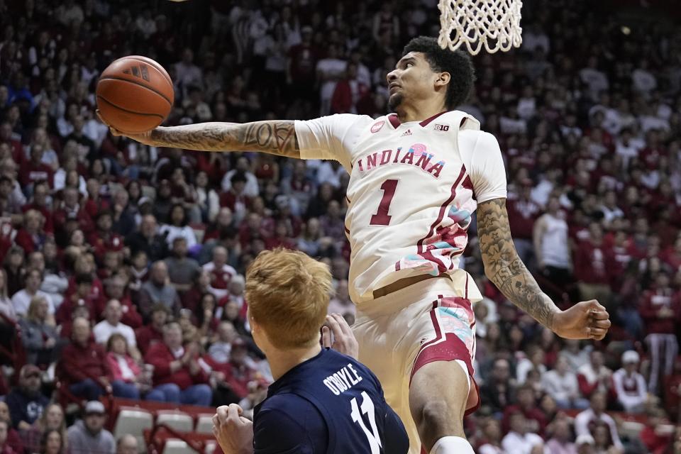 Indiana's Kel'el Ware (1) grabs a rebound over Penn State's Leo O'Boyle (11) during the second half of an NCAA college basketball game, Saturday, Feb. 3, 2024, in Bloomington, Ind. (AP Photo/Darron Cummings)