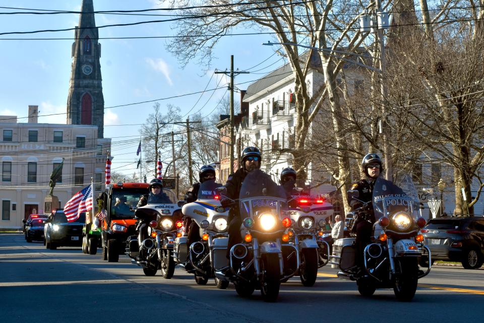 A convoy of emergency service workers, soldiers and veterans escorted a delivery of holiday wreaths for Wreaths Across America as it passed through the village of Goshen on Wednesday.
