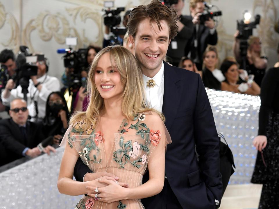 Suki Waterhouse, left, and Robert Pattinson attend The Metropolitan Museum of Art's Costume Institute benefit gala celebrating the opening of the "Karl Lagerfeld: A Line of Beauty" exhibition on Monday, May 1, 2023, in New York.