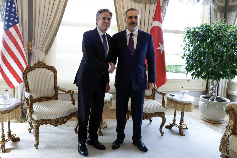 U.S. Secretary of State Antony Blinken, left, shakes hands with Turkish Foreign Minister Hakan Fidan at Vahdettin, a private residence of the Presidency, in Istanbul, Turkey, Saturday, Jan. 6, 2024. (Evelyn Hockstein/Pool Photo via AP)