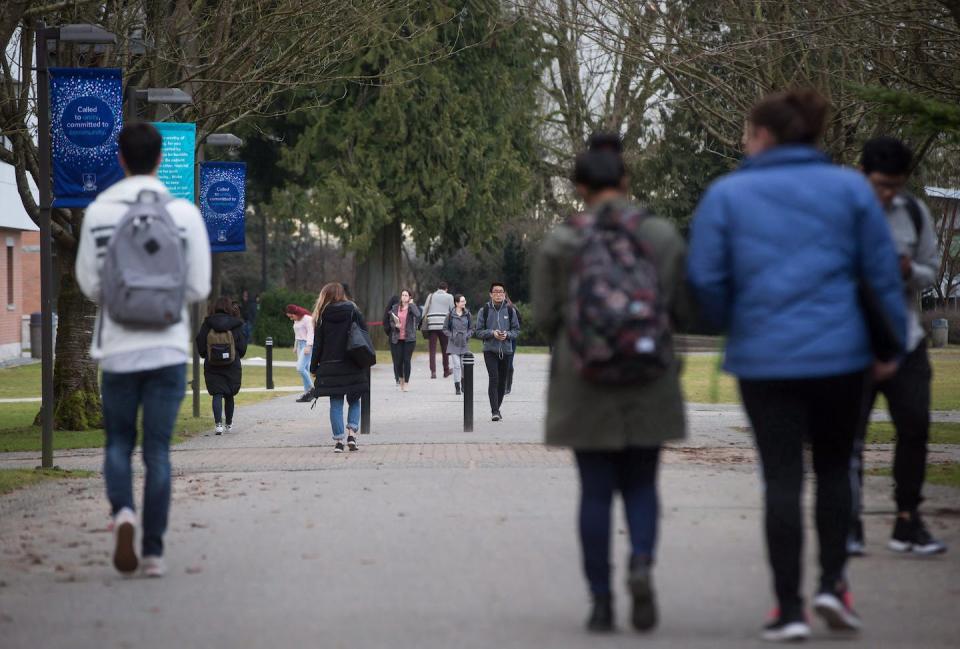 Universities can engage more community partners in working towards well-defined goals and milestones to promote wellness. Students walk on campus at Trinity Western University in Langley, B.C., in 2017. THE CANADIAN PRESS/Darryl Dyck