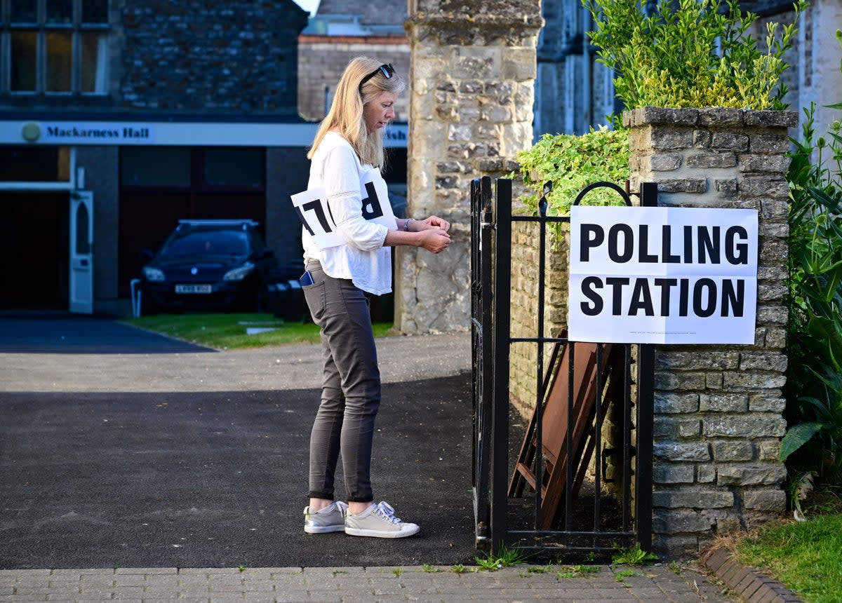 Signs are put up at a polling station in the Tiverton and Honiton by-election (Getty)