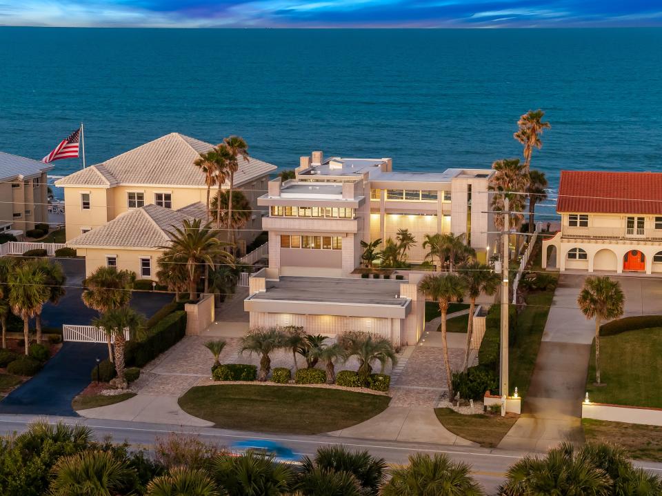 This is an aerial view looking towards the east of the three-story beachfront luxury home at 489 Ocean Shore Blvd. in Ormond Beach that was put up for sale on March 2, 2024, with an asking price of $5 million. Built in 1994, the 6-bedroom, 9-bath home offers 7,483 square feet of living space includes an infinity pool in back. It was once owned by a descendant of the bottling company that designed and patented the iconic Coca-Cola bottle in 1915.