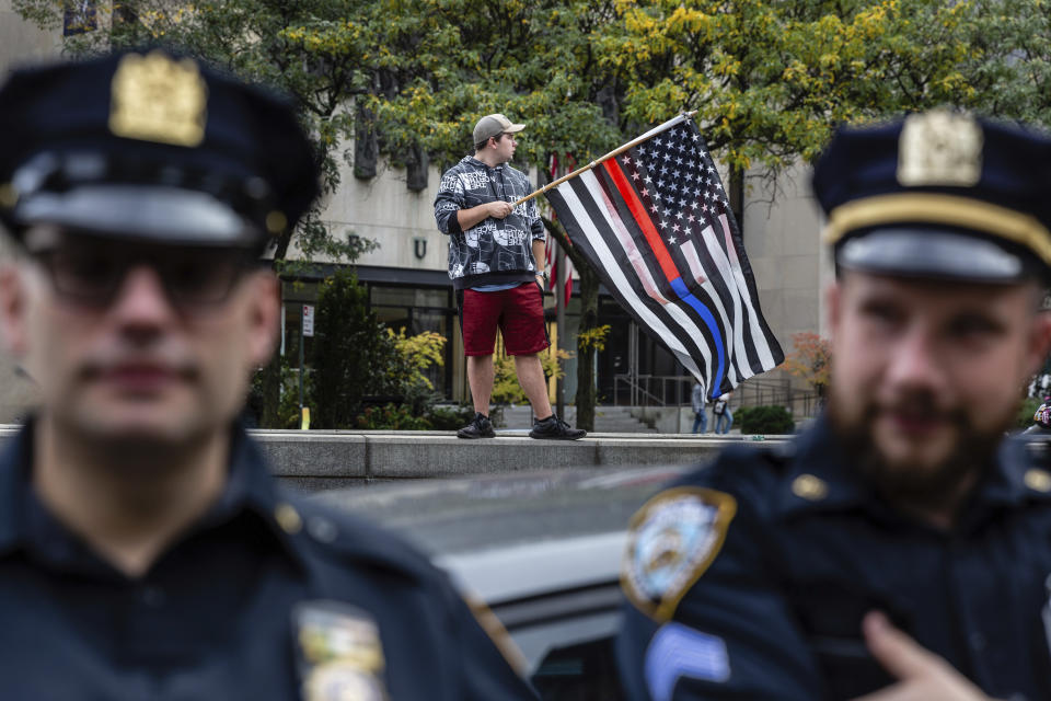 New York City municipal workers protest outside City Hall against the coming COVID-19 vaccine mandate, Monday, Oct. 25, 2021, in New York. New York City employees are required to show proof of at least one vaccine dose by Friday, Oct. 29. (AP Photo/Timothy Fadek)