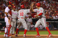 ST. LOUIS, MO - MAY 25: Hunter Pence #3 of the Philadelphia Phillies is congratulated by Juan Pierre #10 of the Philadelphia Phillies after Pence hit the game-winning home run in the tenth inning as Yadier Molina #4 of the St. Louis Cardinals looks on at Busch Stadium on May 25, 2012 in St. Louis, Missouri. (Photo by Dilip Vishwanat/Getty Images)