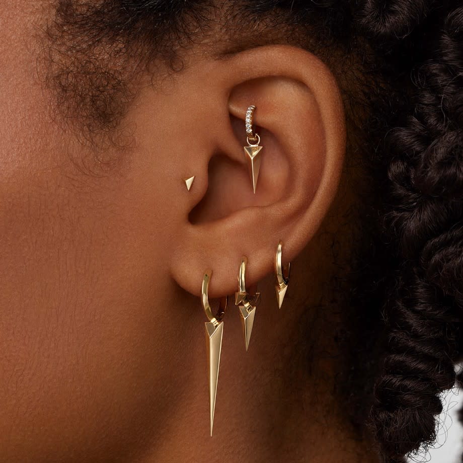  Rook Piercing on an earlobe with maria tash earrings. 