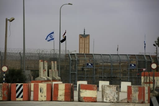 Israeli and Egyptian flags seen at the Nitzana border crossing along their border near the Israeli village of Nitzanei Sinai