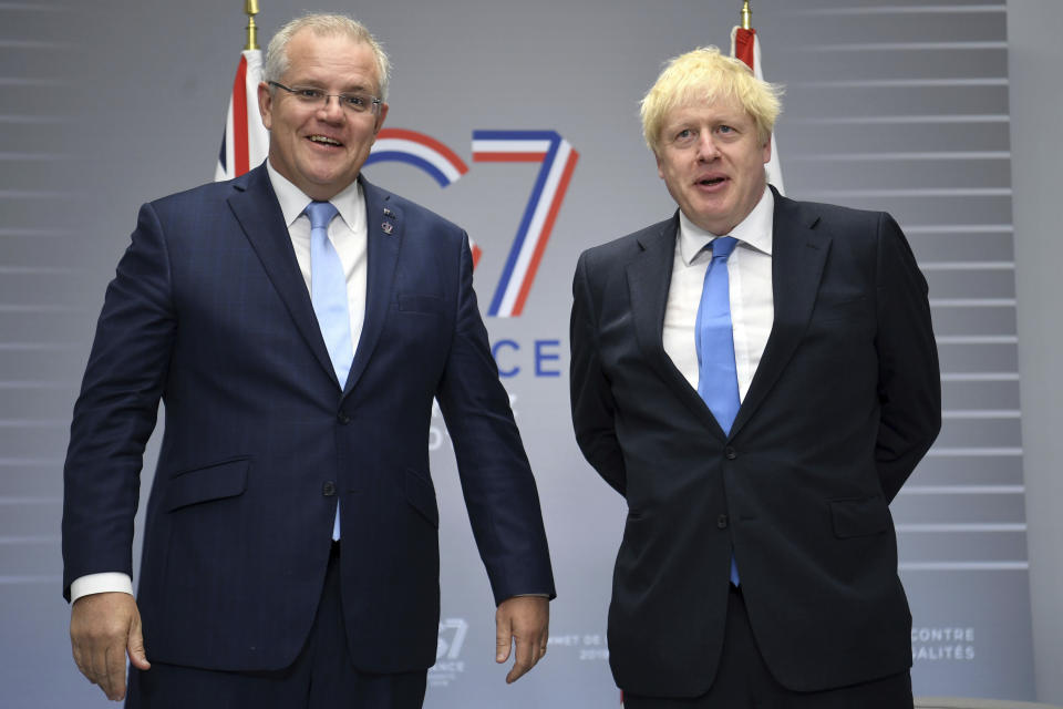 British Prime Minister Boris Johnson, right, meets Australian Prime Minister Scott Morrison for bilateral talks during the G-7 summit in Biarritz, France,Monday Aug. 26, 2019. (Neil Hall/PA via AP)