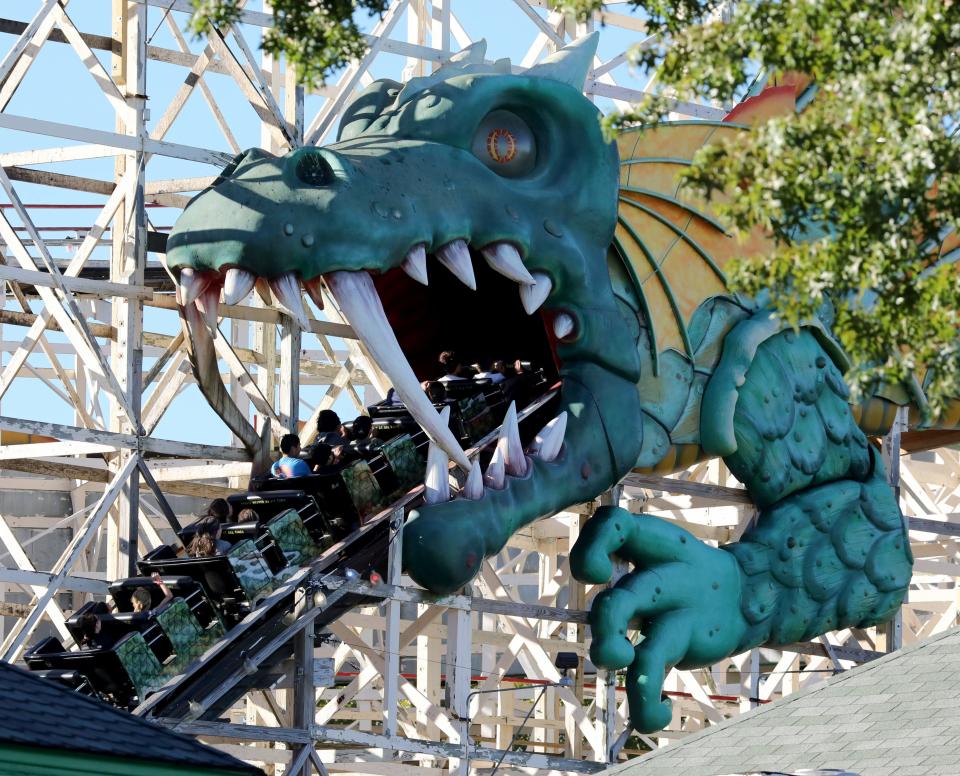 Coaster enthusiasts enter the mouth of the dragon on the Dragon Coaster at Playland Amusement Park in Rye, on the last weekend of the season, Sept. 24, 2022. 