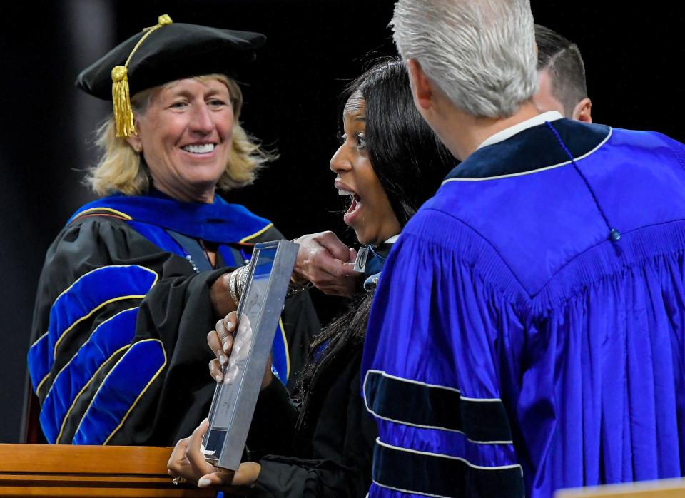 President Noelle Cockett, left, bestows an honorary degree of Humane Letters to Mia Love during Utah State University’s commencement ceremony on Thursday, May 4, 2023, in Logan, Utah. | Eli Lucero, Herald Journal