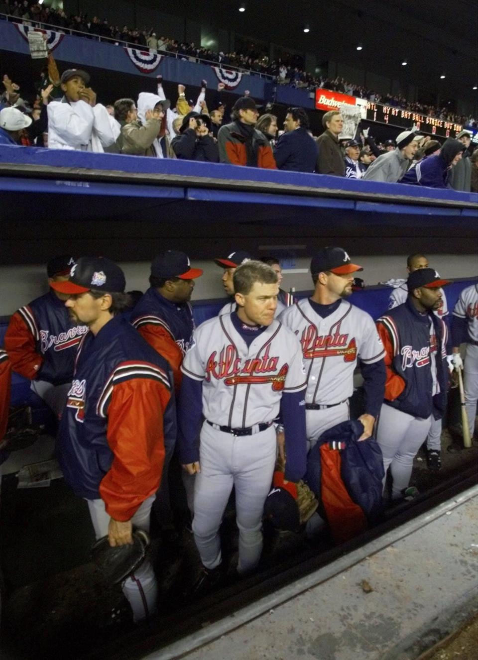 Braves players file out of the dugout after the Yankees won game 4 to sweep the World Series in 1999.