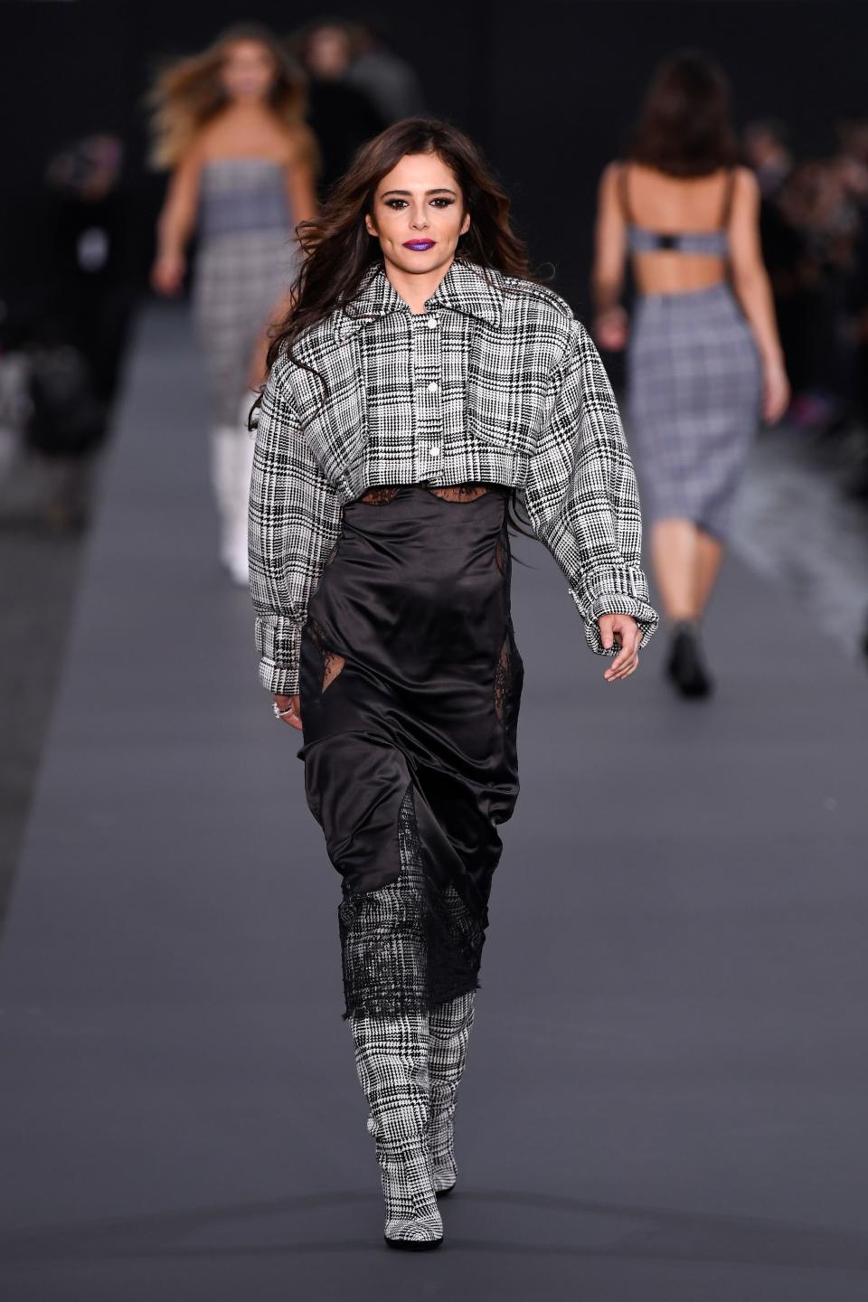 <p>Cheryl made her first public debut since giving birth in a boxy checked shirt and super high-waisted trousers. (Photo: Getty Images) </p>