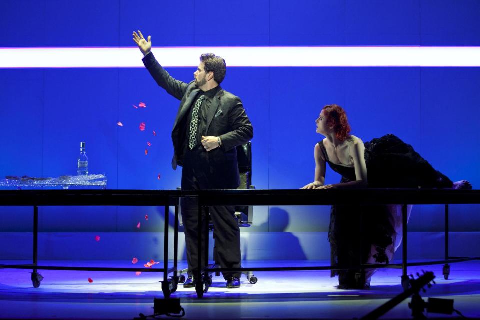 In this May 10, 2012 photo provided by the New York City Opera, Nicholas Pallesen is in the role of Pluto, with Catherine Miller as Thanatos at a dress rehearsal of the New York City Opera's Orpheus, at El Museo del Barrio in New York. (AP Photo/NYC Opera, Pavel Antonov)