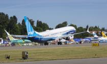 The final version of the 737 MAX, the MAX 10, passes other 737 MAX planes as it takes off from Renton Airport in Renton, Wash., on its first flight Friday, June 18, 2021. The plane will fly over Eastern Washington and then land at Boeing Field. (Ellen M. Banner/The Seattle Times via AP, Pool)