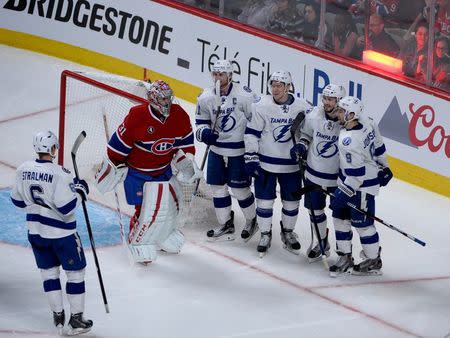 Tampa Bay Lightning forward Nikita Kucherov (86) reacts with teammates including Steven Stamkos (91) and Ondrej Palat (18) after scoring a goal against Montreal Canadiens goalie Carey Price (31) during the third period in game two of the second round of the 2015 Stanley Cup Playoffs at the Bell Centre. Mandatory Credit: Eric Bolte-USA TODAY Sports