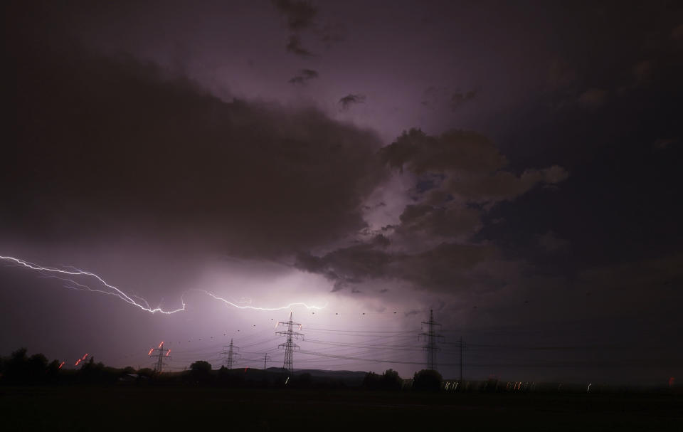 Lightning flashes across the night sky in Stuttgart, Geremany, Friday, May 20, 2022. (Andreas Rosar/dpa via AP)