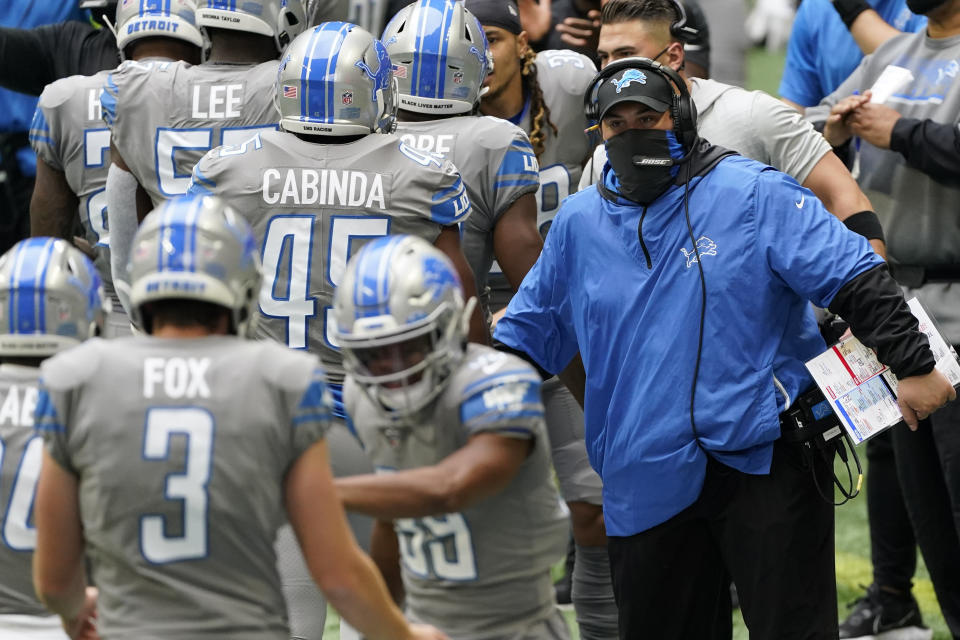 Detroit Lions head coach Matt Patricia greets players after a touchdown against the Atlanta Falcons during the first half of an NFL football game, Sunday, Oct. 25, 2020, in Atlanta. (AP Photo/John Bazemore)