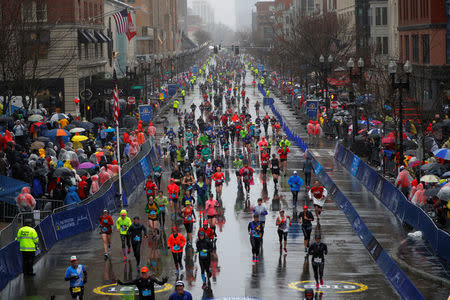 FILE PHOTO: Runners approach the finish line on Boylston Street during the 122nd Boston Marathon in Boston, Massachusetts, U.S., April 16, 2018. REUTERS/Brian Snyder