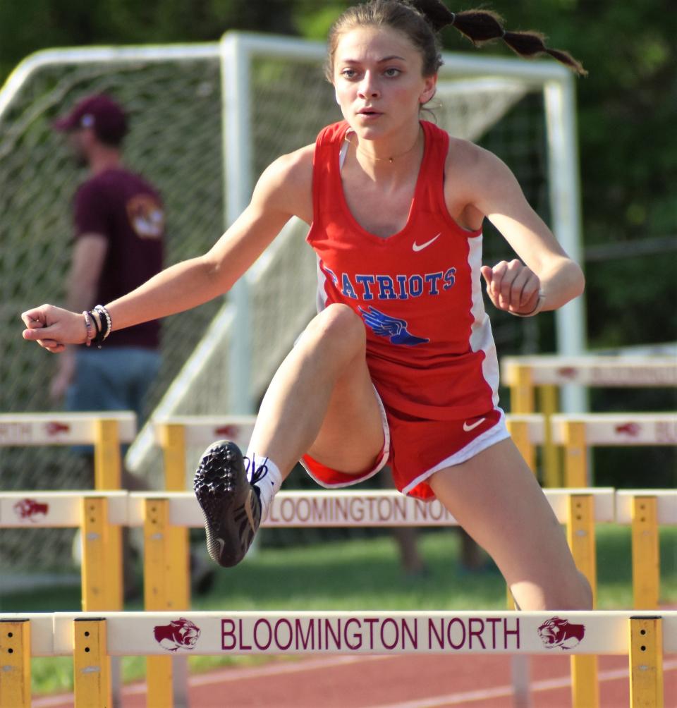 Owen Valley's Emma Bault runs the 100-meter hurdles at the Bloomington North sectional on May 17, 2022.