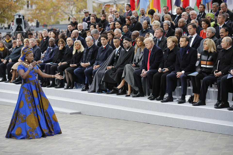 FILE - In this Sunday, Nov. 11, 2018 file photo Benin's Angelique Kidjo performs in front of heads of states and world leaders during ceremonies at the Arc de Triomphe in Paris. One of Africa's iconic artists, Kiddo, is the voice of a new project aimed at rewriting laws across the African continent that keep millions of women from becoming a more powerful economic force. (AP Photo/Francois Mori, Pool, File)