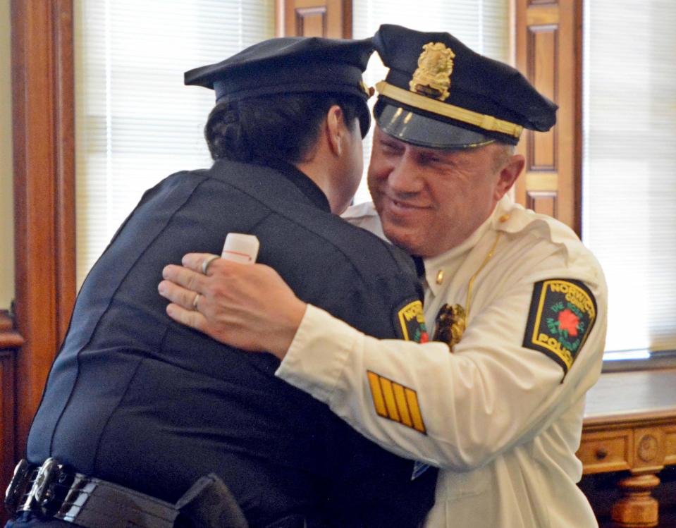 Lt. Josip Peperni gives Sgt. Julie St. Jean a hug during the Norwich Police swearing-in ceremony at Norwich, Connecticut, City Hall in 2018.