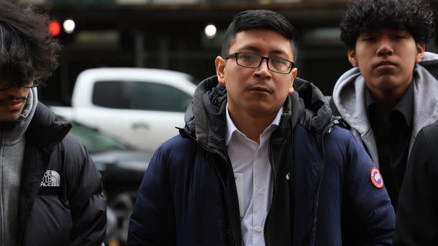 Marco Pina is pictured (center) outside District Attorney Alvin Bragg's offices in downtown Manhattan on Tuesday.