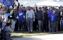 Tiger Woods waits to hit his second shot from the rough alongside a pathway on the 17th hole of the north course during the second round of the Farmers Insurance Open golf tournament Friday, Jan. 27, 2017, at Torrey Pines Golf Course in San Diego. (AP Photo/Gregory Bull)