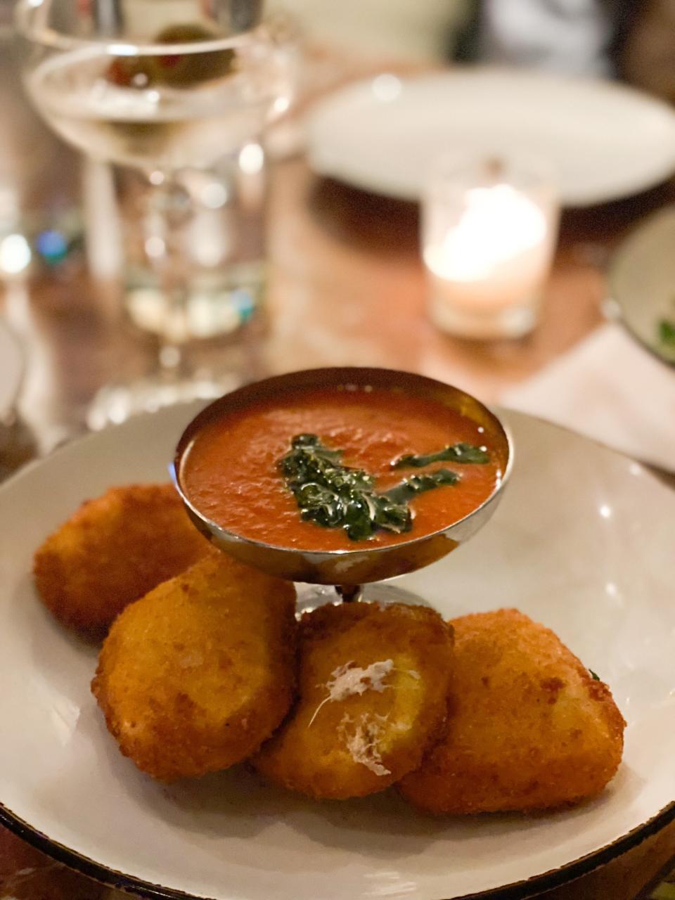 Fried Mozz antipasti on Andrew Michael Italian Kitchen's new Family Night menu.  The crispy fried mozzarella is served with a homemade tomato sauce for dipping.