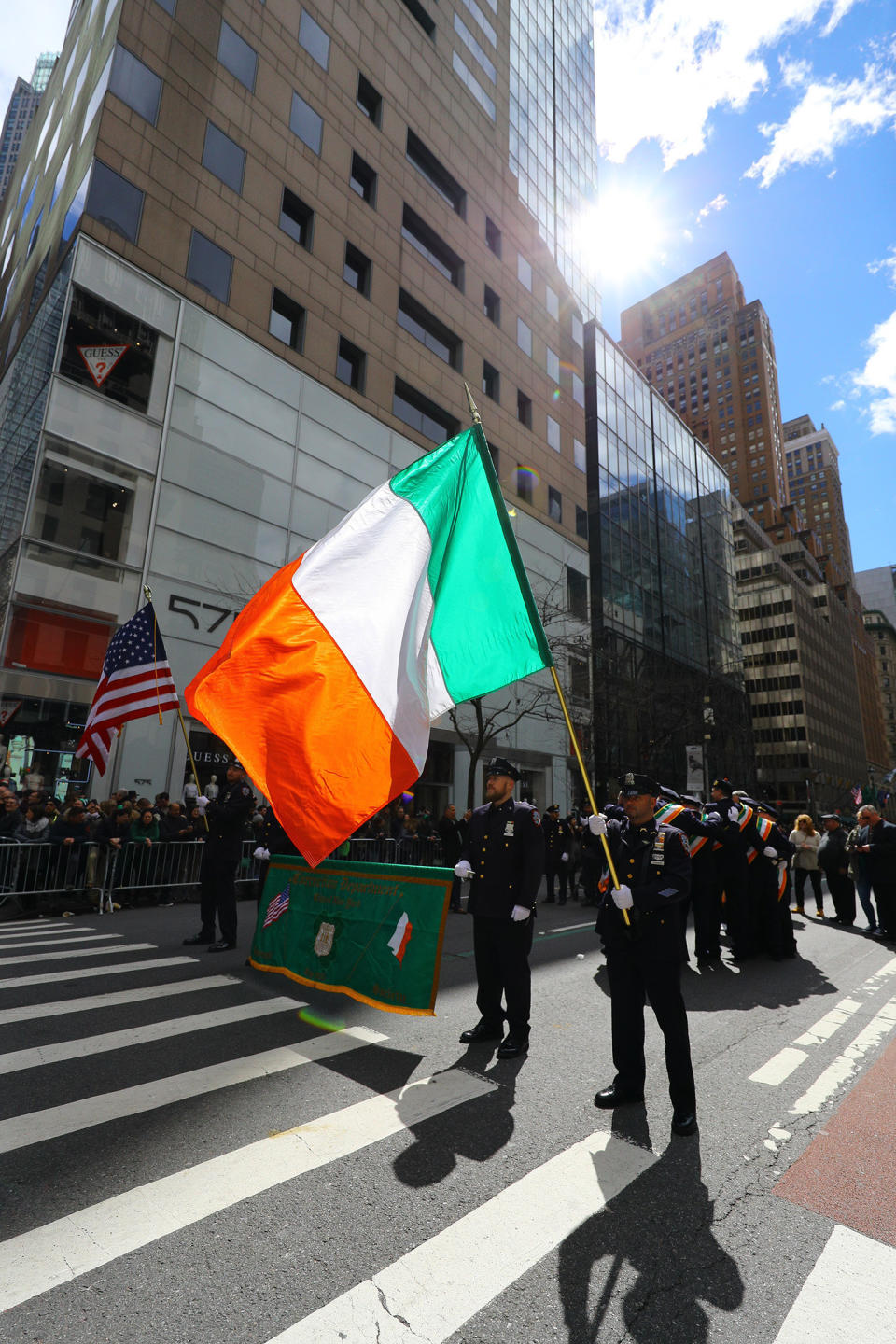 A flag of Ireland passes through the sunlight during the St. Patrick's Day Parade on March 16, 2019, in New York. (Photo: Gordon Donovan/Yahoo News) 