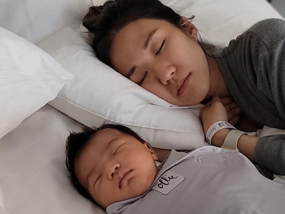 Sophia Cho and her newborn Selah, now two months old, are shown sleeping side-by-side in Cho's suite at Boram Postpartum Retreat.