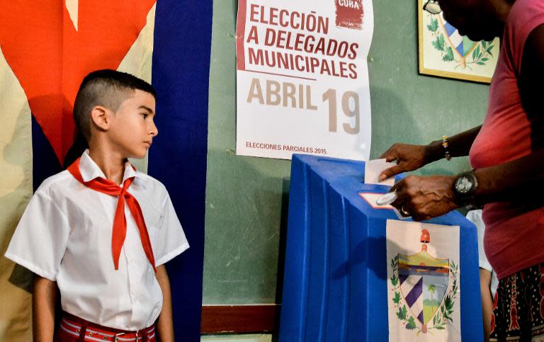 A woman casts her vote at a polling station in Nautico neighbourhood in Havana, Cuba, on April 19, 2015, during municipal elections
