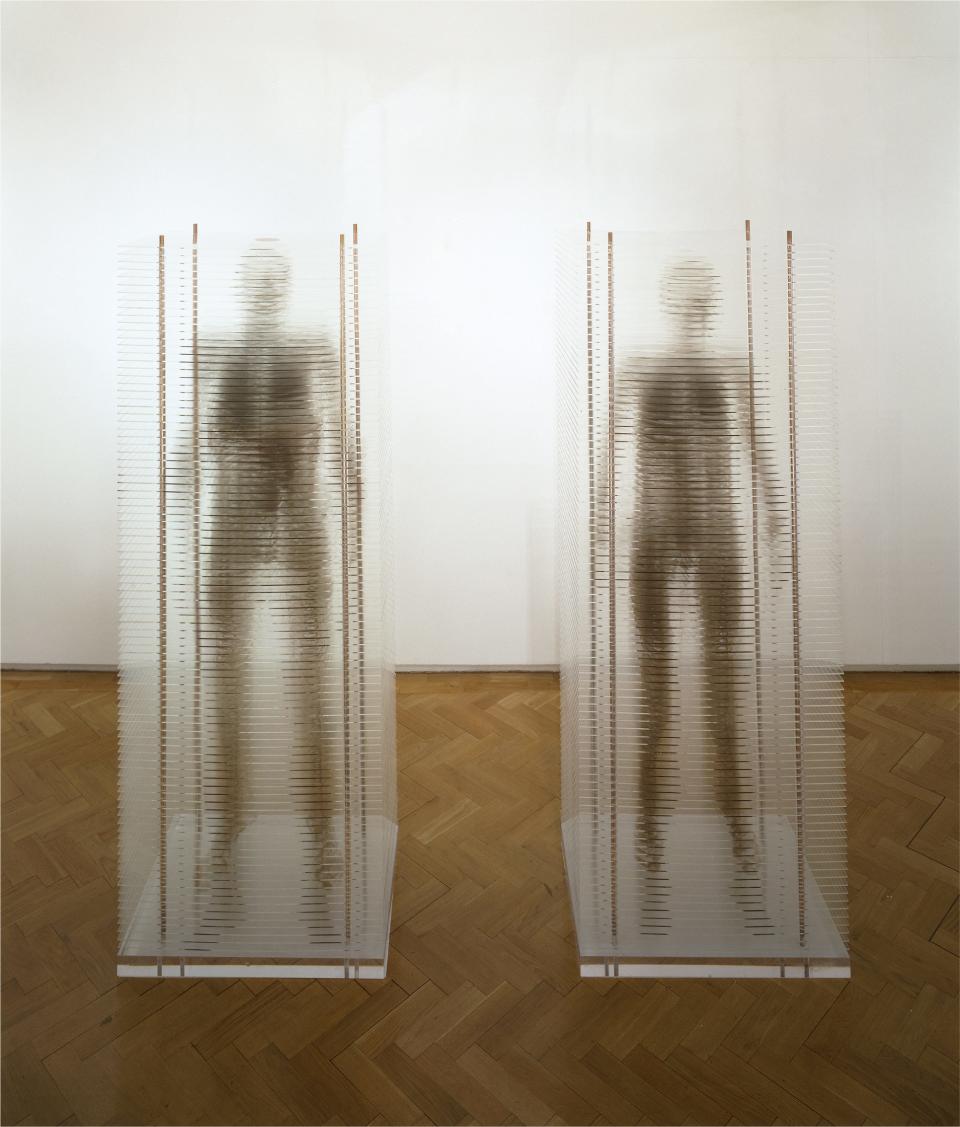 Marilène Oliver (London, England 1977; lives and works in Alberta, Canada), Family Portrait (Mum and Dad), 2003. Bronze ink screen-printed on acrylic sheets, edition 4/6, 75 1/2 x 27 1/2 x 19 5/8 inches. Knoxville Museum of Art, 2015 purchase with funds provided by KMA Collectors Circle and partial gift of the artist.