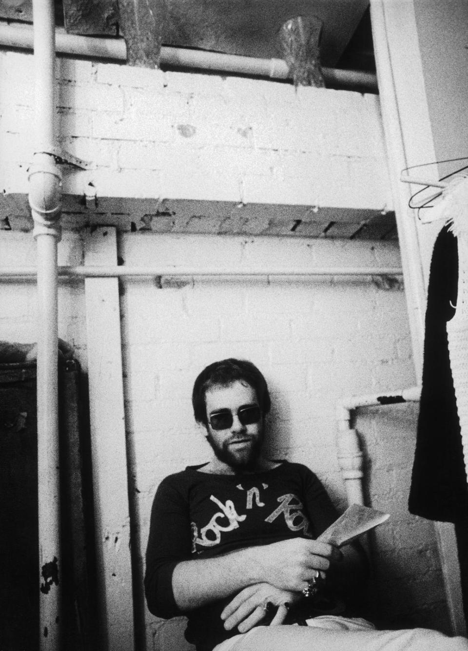 <p>Elton John relaxes backstage at Doug Weston's Troubadour on August 25, 1970 in Los Angeles (now West Hollywood), California.</p>