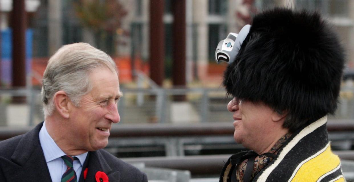 King Charles, left, then Prince of Wales, talks with artist Wade Baker, of the Squamish Nation in Vancouver, B.C., in November 2009. THE CANADIAN PRESS/Darryl Dyck