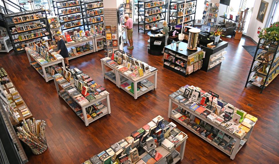 Georgia Court, on far left, owner of Bookstore1Sarasota now has a new location at 117 S. Pineapple Ave. in The Mark condominium building in the heart of downtown Sarasota. The store, with its high ceilings, abundance of windows and upstairs seating area that overlooks the sales floor area. Photographed Thursday afternoon, Feb. 24, 2022.