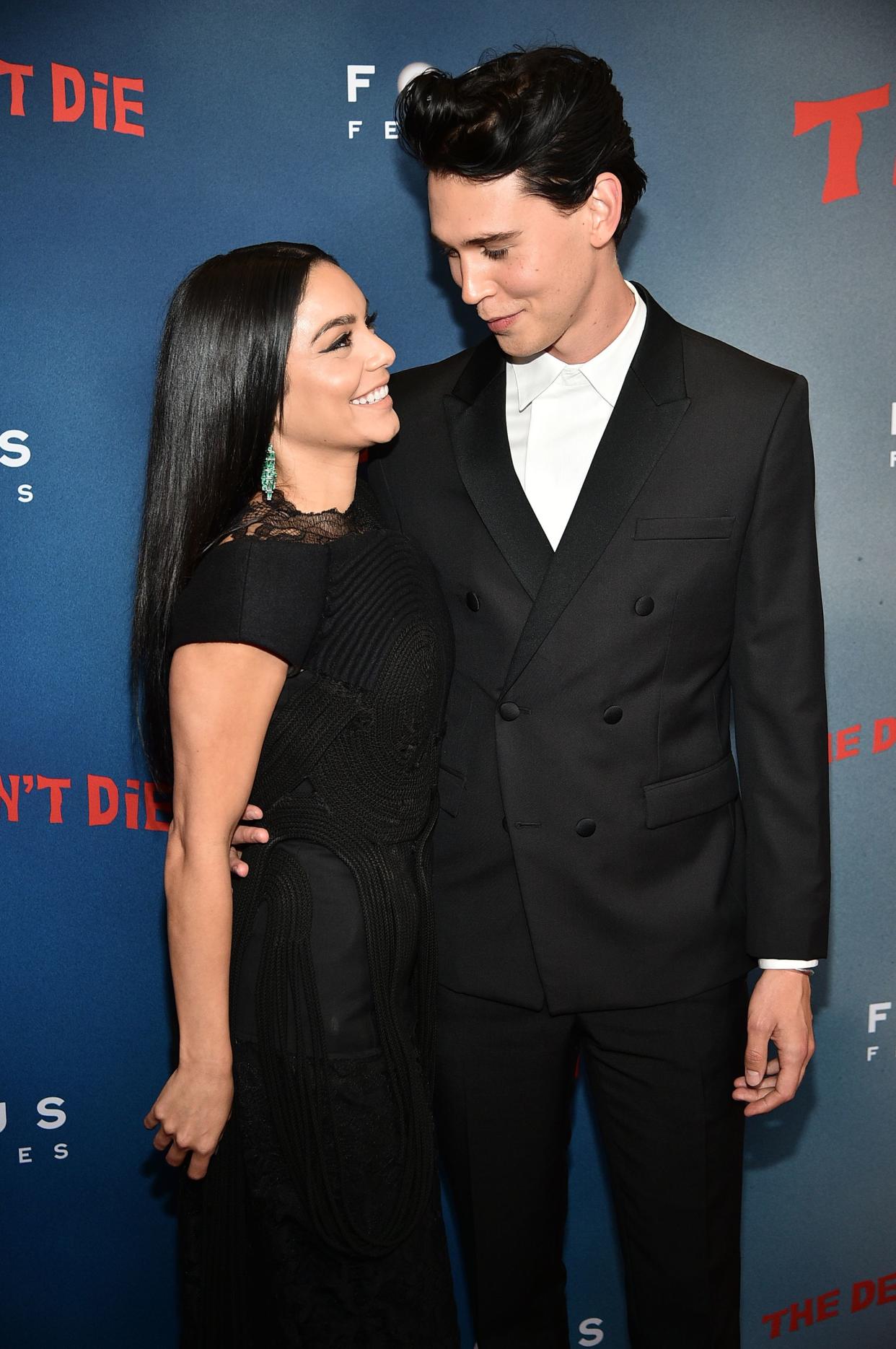 Vanessa Hudgens and Austin Butler share a love picture in all-blsck outfit as they stare intensely at each other.