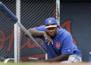 FILE - In this Monday, Feb. 25, 2019 file photo, New York Mets hitting coach Chili Davis watches from the top of the dugout steps during the fifth inning of an exhibition spring training baseball game against the Houston Astros in West Palm Beach, Fla. Hitting coach Chili Davis will keep on working remotely when the New York Mets open summer training camp Friday, July 3, 2020. (AP Photo/Jeff Roberson, File)