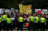 <p>Counter-protesters are watched by police near a white nationalist-led rally marking the one year anniversary of the 2017 Charlottesville ‘Unite the Right’ protests, in Washington, D.C. August 12, 2018. (Photo: Jim Urquhart/Reuters) </p>