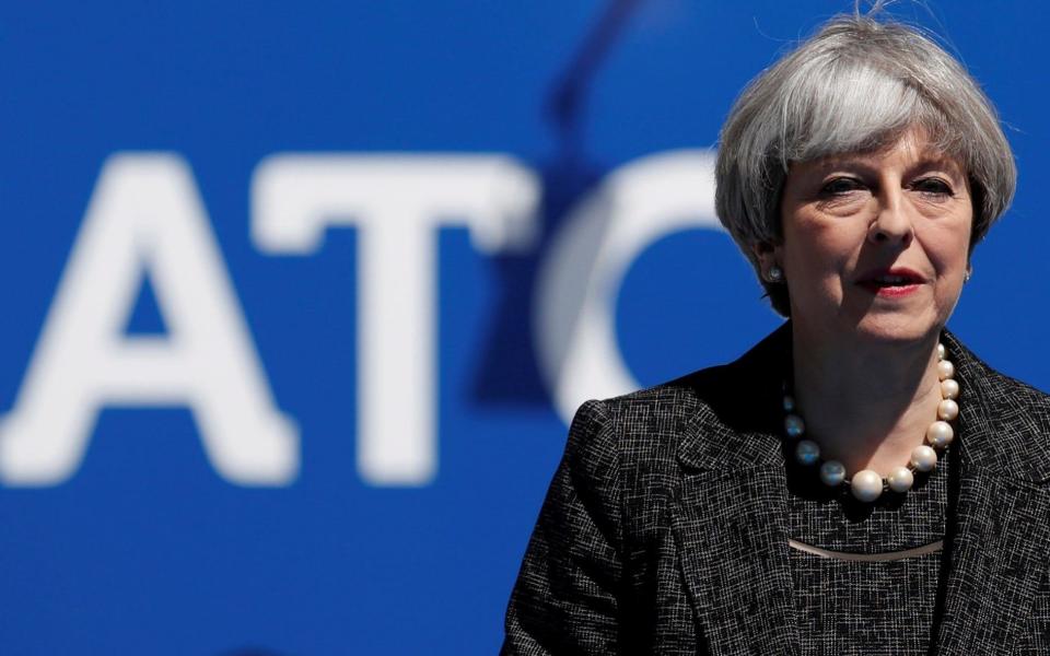 Theresa May arrives to attend the NATO Summit - Credit: REUTERS/Christian Hartmann