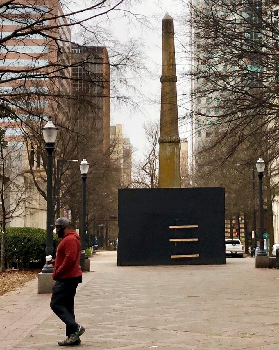 A man walks past a Confederate monument in a park in downtown Birmingham, Ala., on Jan. 15, 2019.