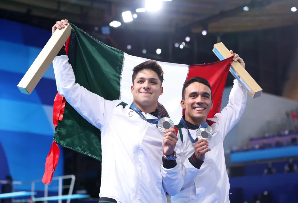 PARIS, FRANCE - AUGUST 02: Silver Medalists Juan Manuel Celaya Hernandez and Osmar Olvera Ibarra of Team Mexico pose following the Diving medal ceremony after the Men's Synchronised 3m Springboard Final on day seven of the Olympic Games Paris 2024 at Aquatics Centre on August 02, 2024 in Paris, France. (Photo by Quinn Rooney/Getty Images)