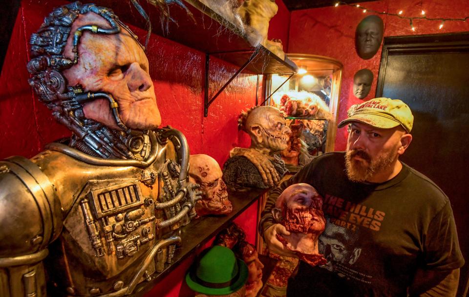 Jonathan Thornton, owner of Southern Fried Monsters, shows off some of the "oddities" in his Montgomery monster studio.