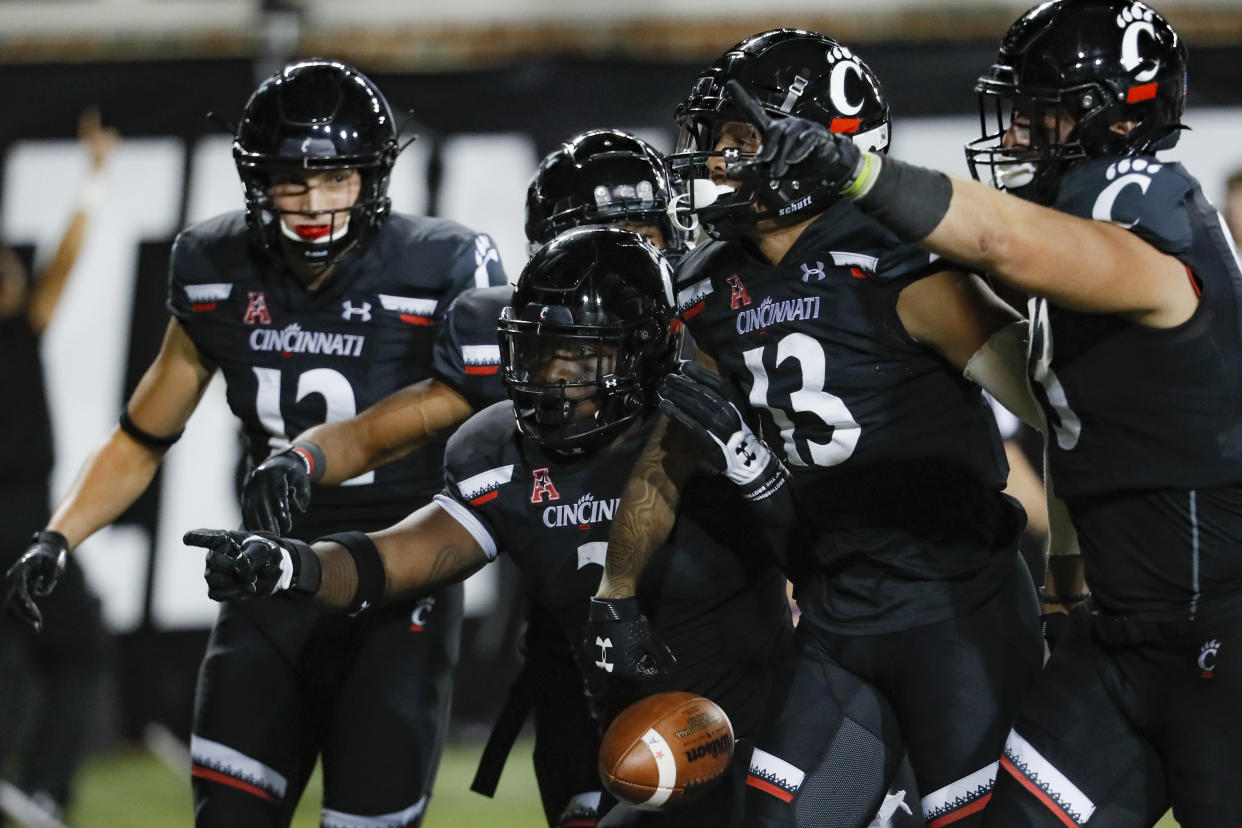 Cincinnati beat UCF 27-24 on Friday night. (AP Photo/John Minchillo)