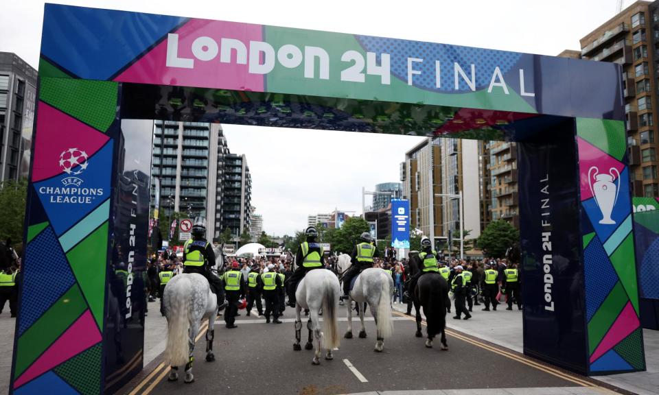 <span>Police officers outside Wembley before the Champions League final between <a class="link " href="https://sports.yahoo.com/soccer/teams/real-madrid/" data-i13n="sec:content-canvas;subsec:anchor_text;elm:context_link" data-ylk="slk:Real Madrid;sec:content-canvas;subsec:anchor_text;elm:context_link;itc:0">Real Madrid</a> and <a class="link " href="https://sports.yahoo.com/soccer/teams/dortmund/" data-i13n="sec:content-canvas;subsec:anchor_text;elm:context_link" data-ylk="slk:Borussia Dortmund;sec:content-canvas;subsec:anchor_text;elm:context_link;itc:0">Borussia Dortmund</a>. </span><span>Photograph: Paul Childs/Action Images/Reuters</span>