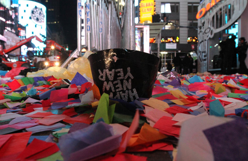 Confetti and other debris are seen in New York's Times Square early New Year's Day Wednesday Jan. 1, 2014. (AP Photo/Tina Fineberg)