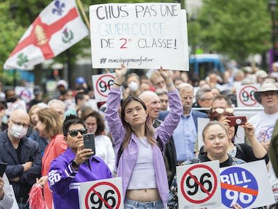 A protest against Bill 96 in Montreal on May 26, 2022. The law forbids provincial government agencies and municipal bodies from making systematic use of languages other than French. (CP/Graham Hughes)